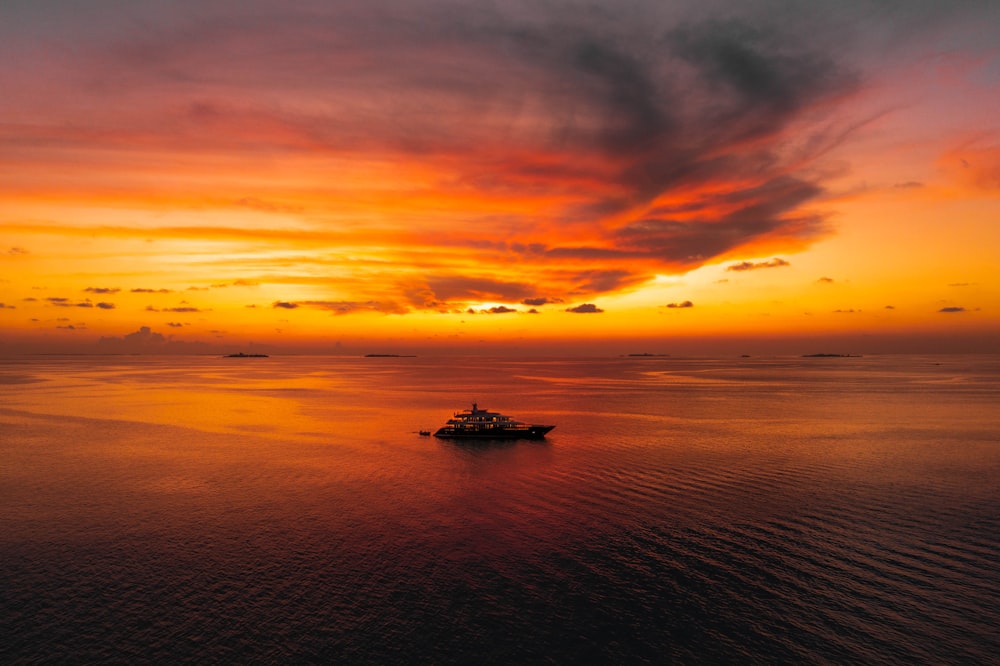 a boat floating on top of a large body of water