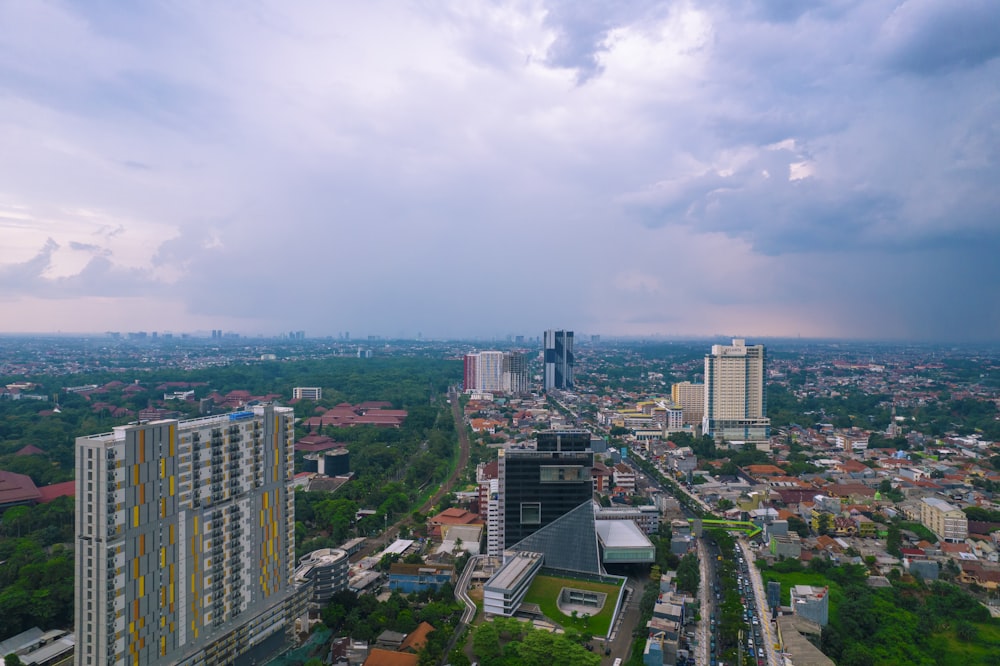 an aerial view of a city with tall buildings