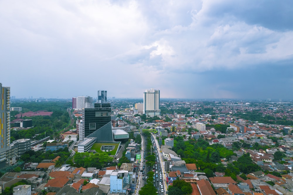 an aerial view of a city with tall buildings