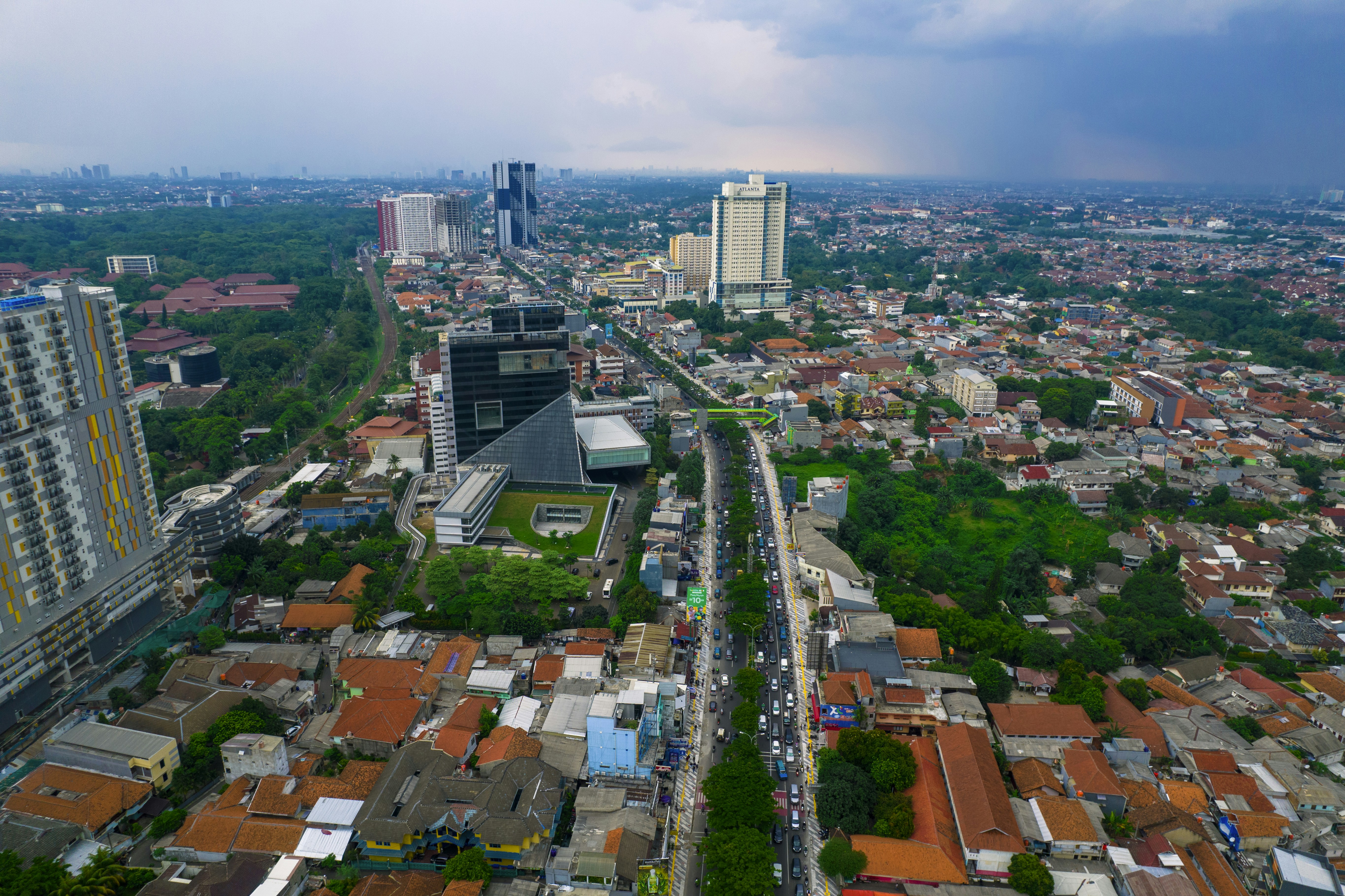 an aerial view of a city with tall buildings