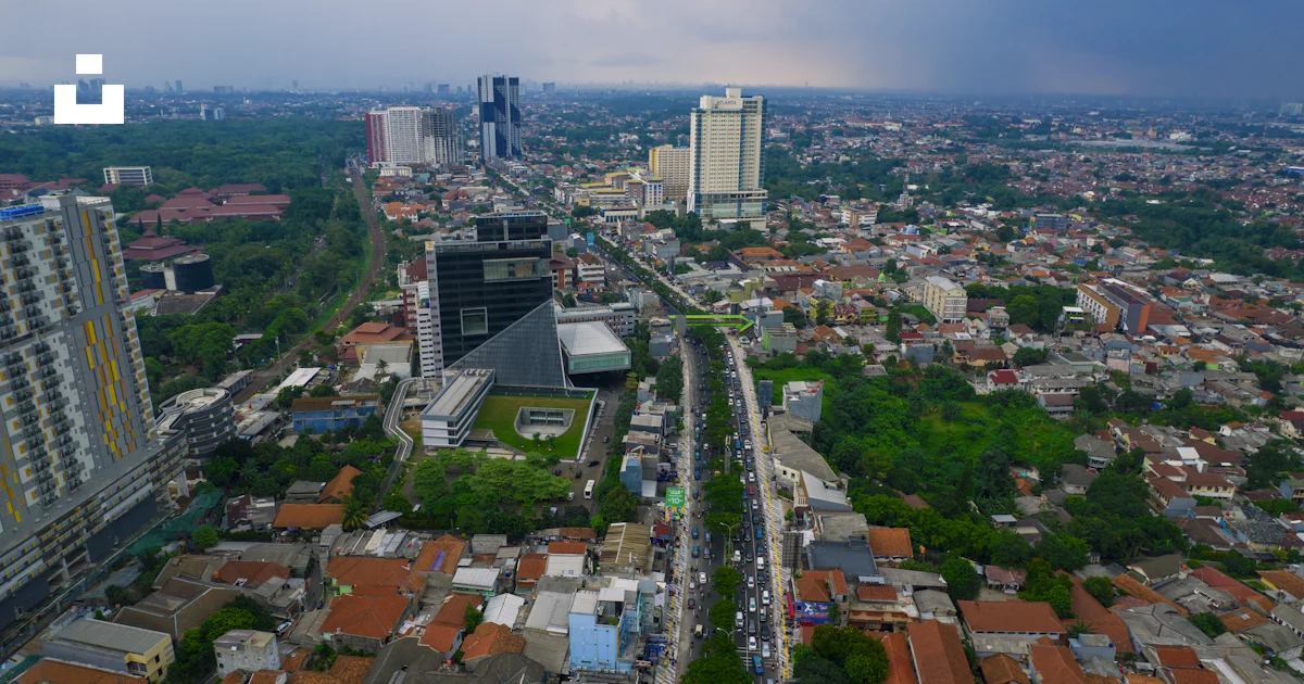 An aerial view of a city with tall buildings photo – Free West java ...