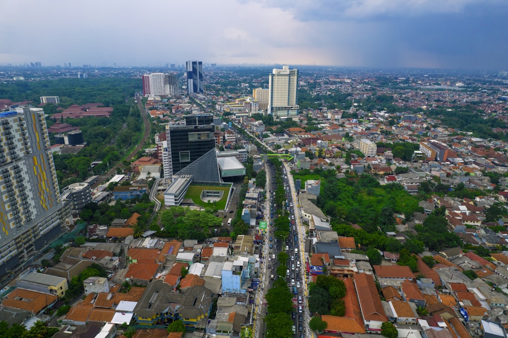 an aerial view of a city with tall buildings