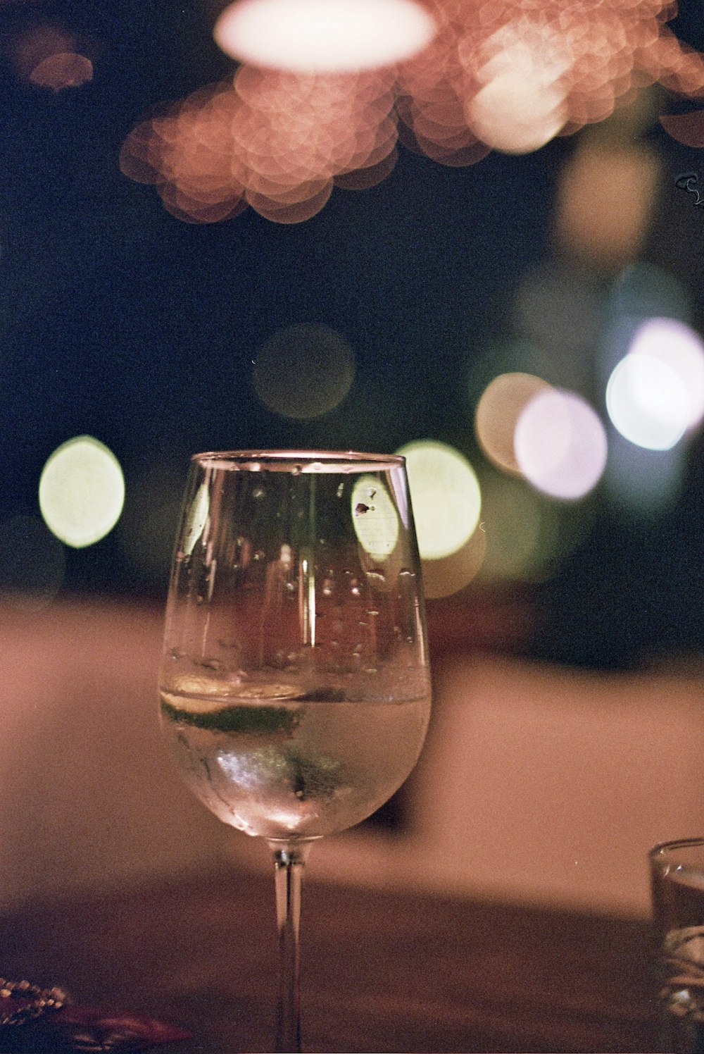 a close up of a wine glass on a table