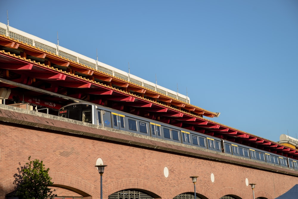 a train on a train track near a building