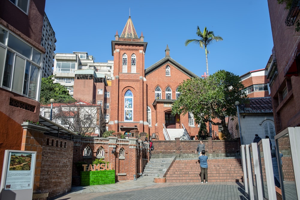 a brick building with a steeple on top of it