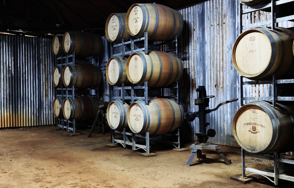 a room filled with lots of wooden barrels