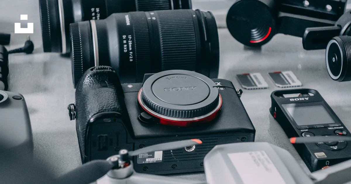 A collection of electronic devices sitting on top of a table photo ...