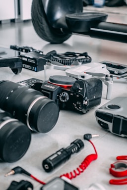 a table topped with lots of different types of cameras