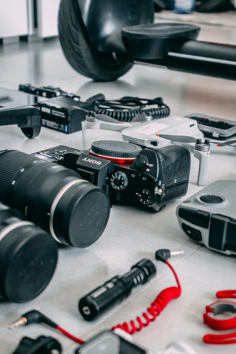 a table topped with lots of different types of cameras