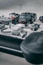 A sleek modern office setup with a drone and camera equipment ready for a luxury real estate shoot.