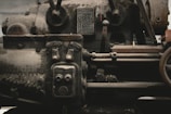 a black and white photo of an old train engine