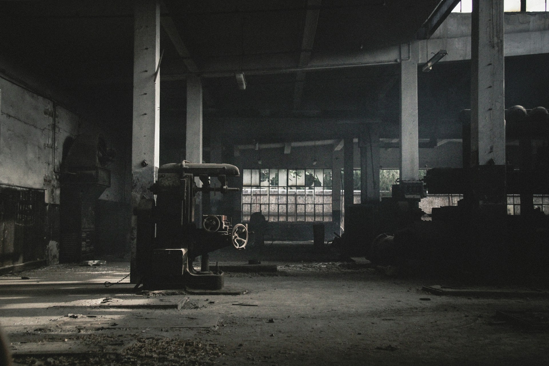 an old warehouse with a forklift in the middle of it