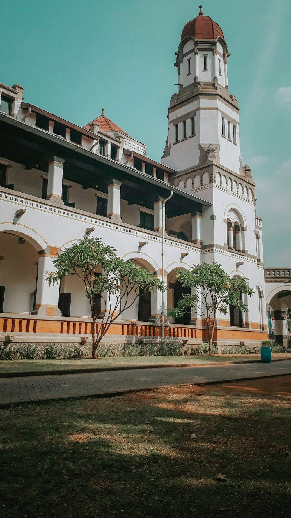 a large white building with a clock tower