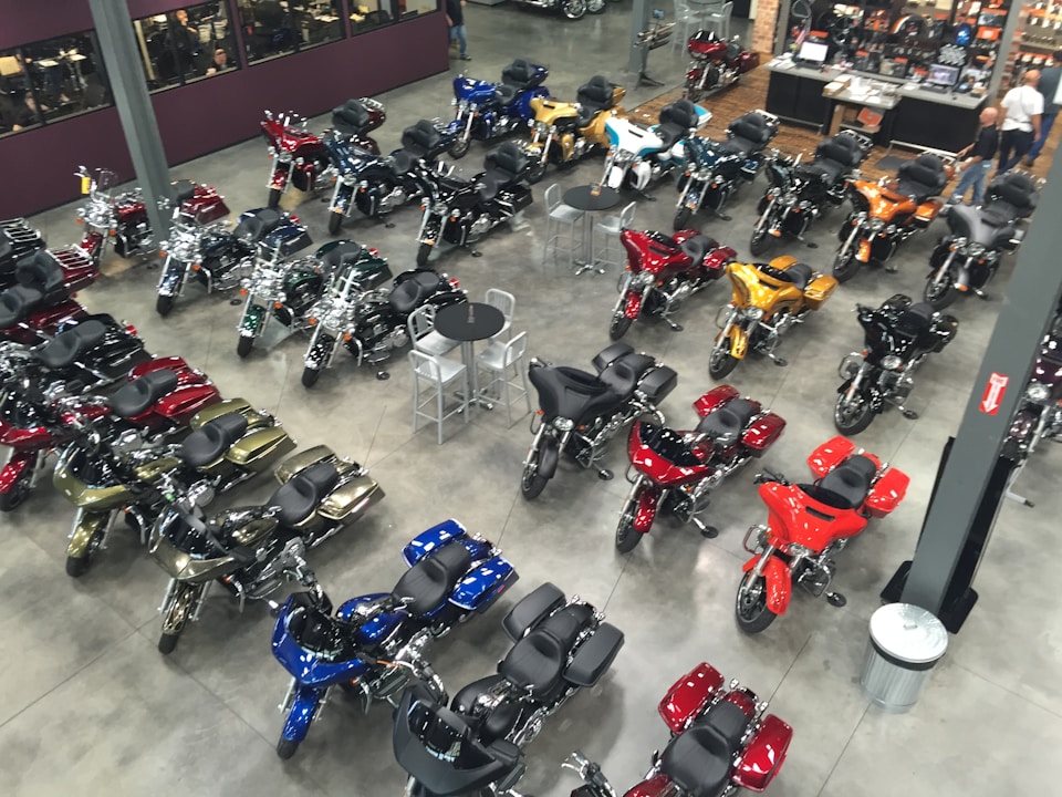 A motorcycle shop with a variety of cycles on display in different colors