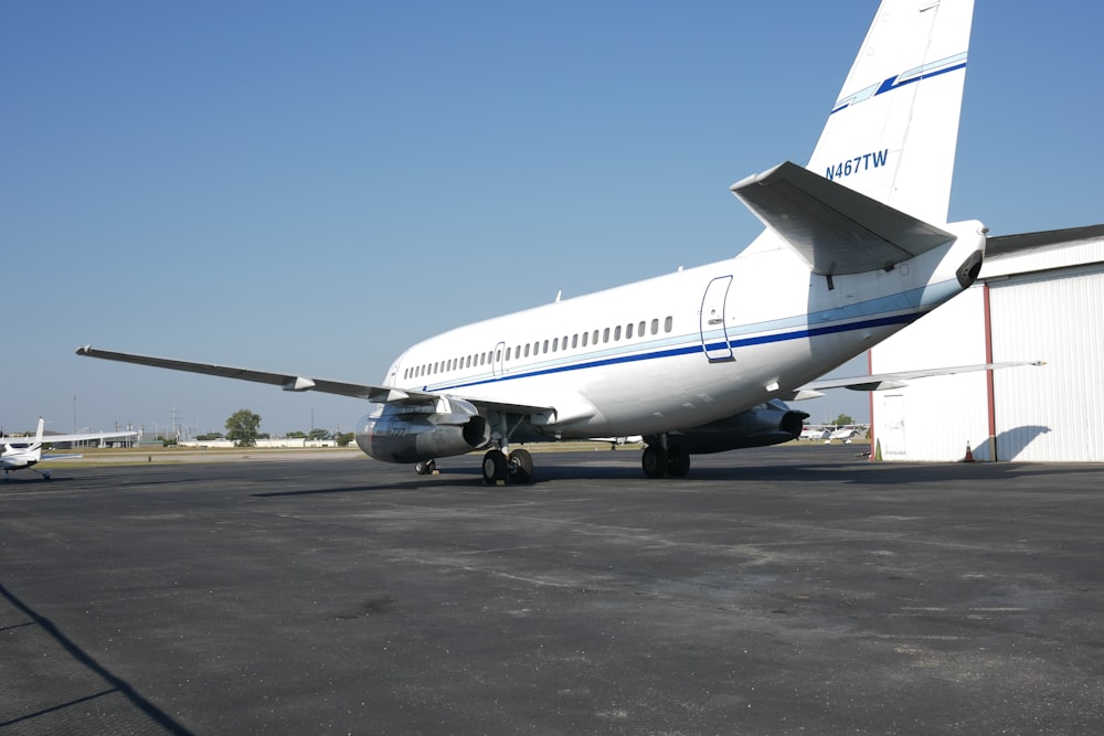 a large jetliner sitting on top of an airport tarmac