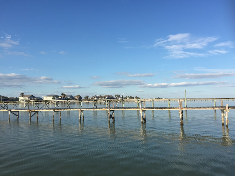 a long wooden bridge over a body of water