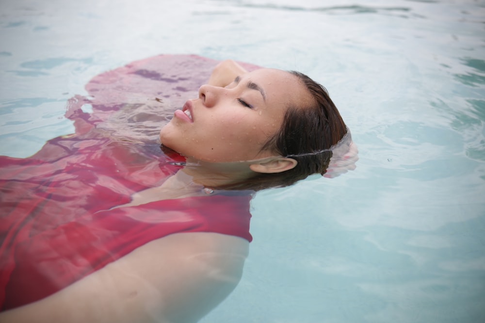 a woman floating in a pool of water