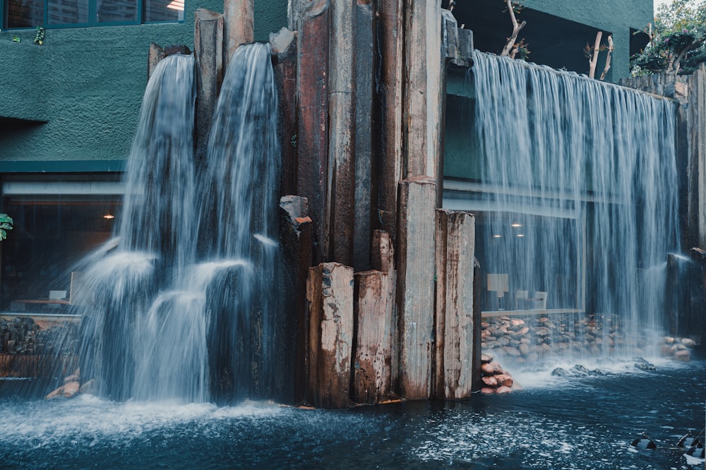 a water fall in front of a building