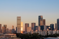 a view of a city with tall buildings