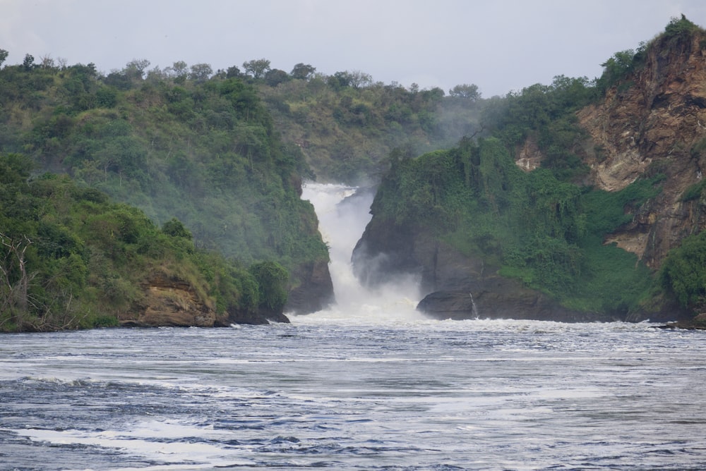 a river with a waterfall in the middle of it