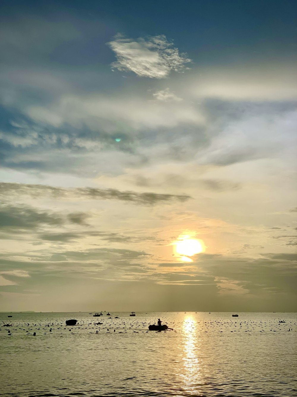 a couple of boats floating on top of a large body of water