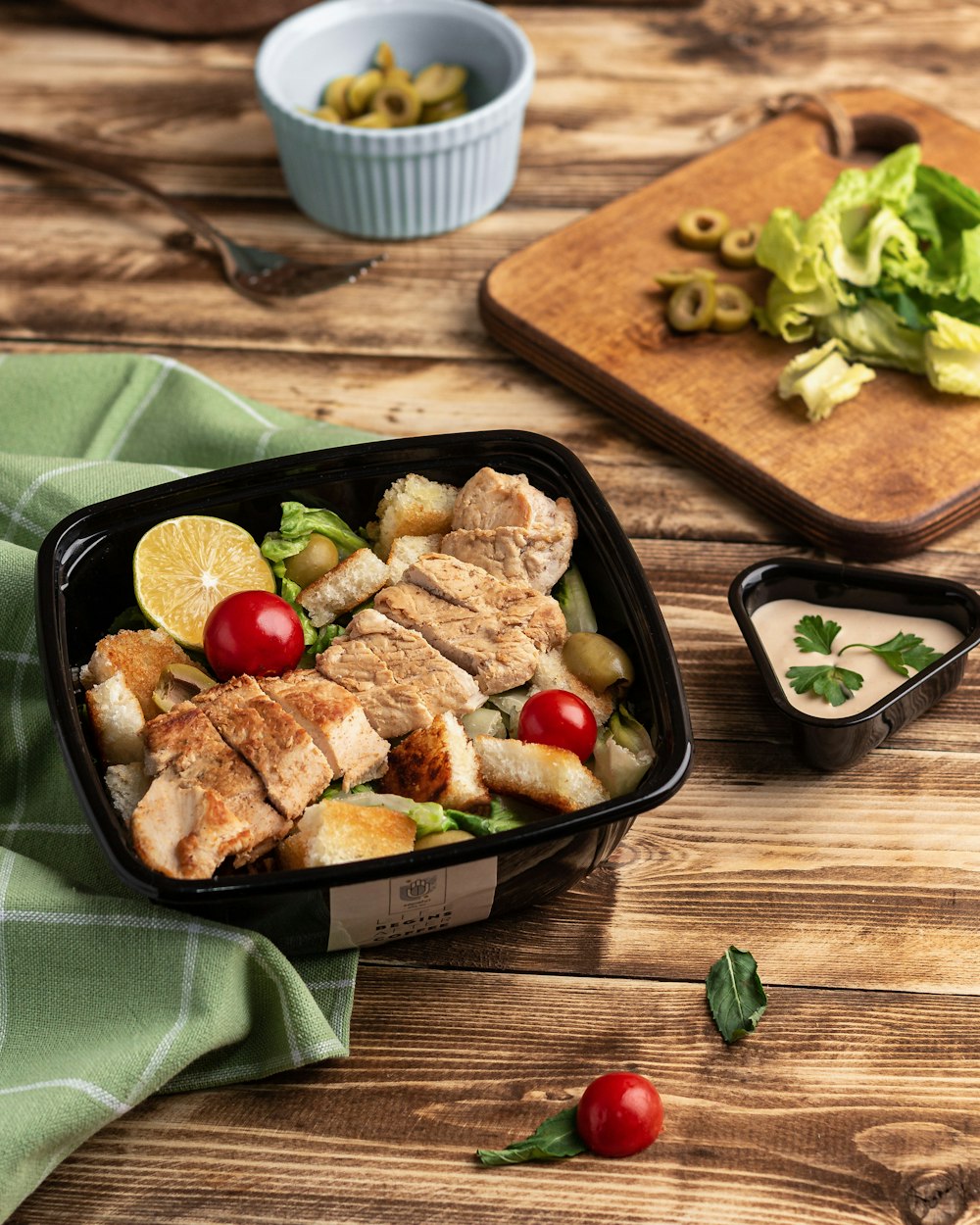 a tray of food on a wooden table