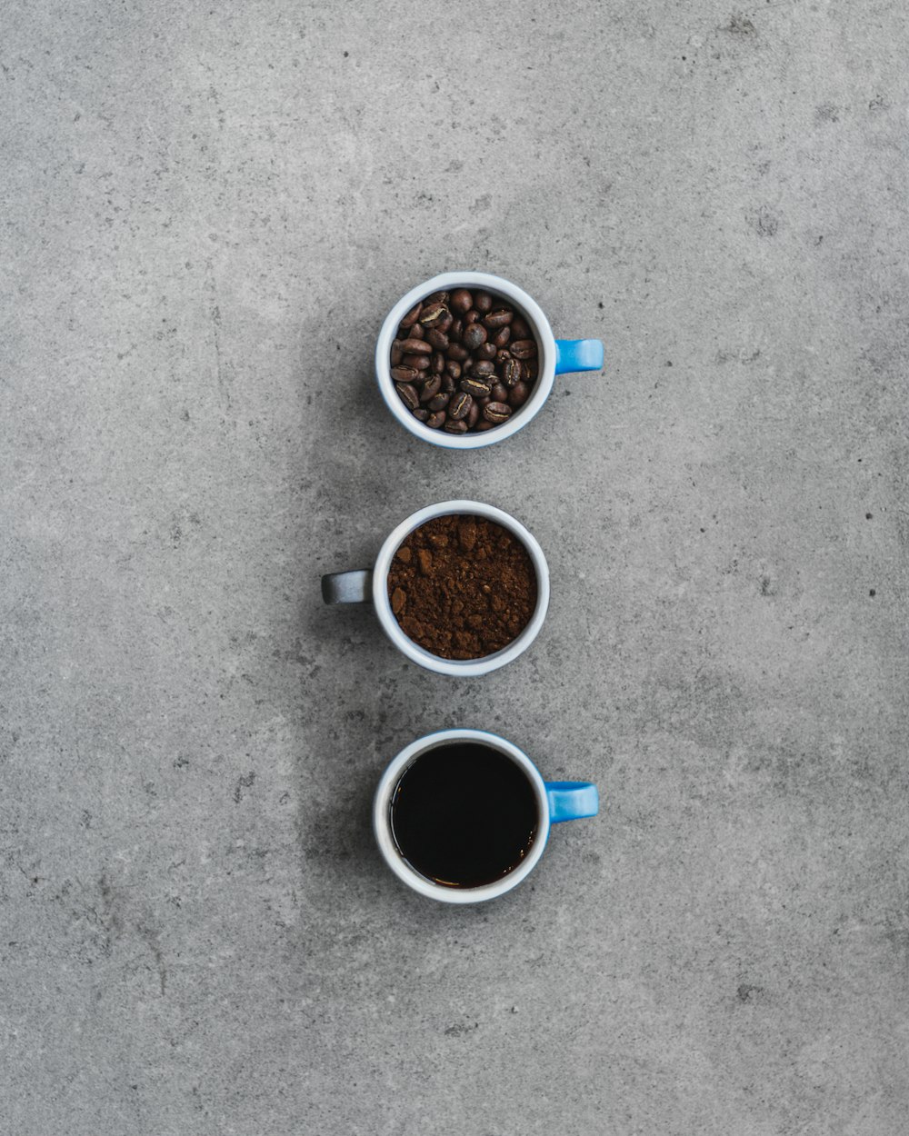 three cups of coffee sit next to each other