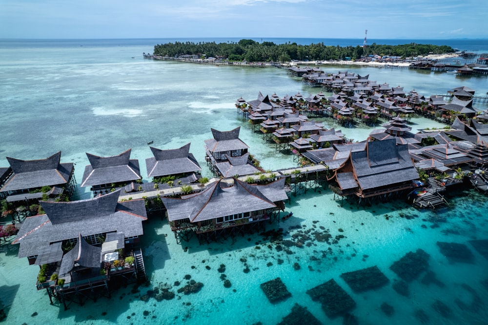 an aerial view of a resort in the ocean