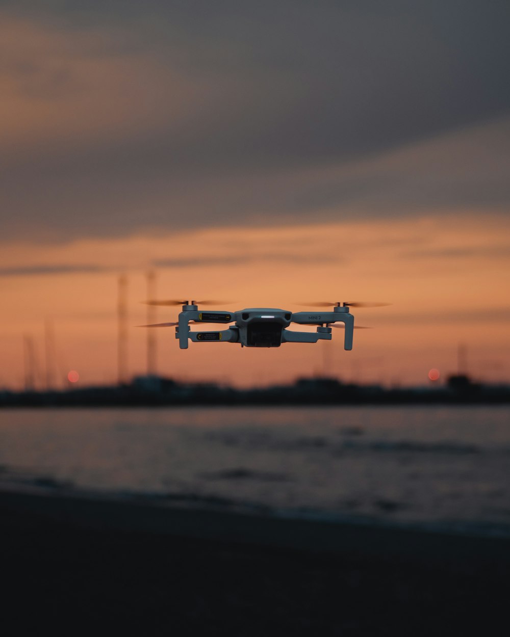 a small airplane flying over a body of water