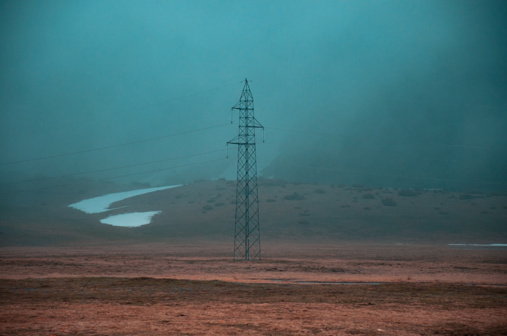 a telephone pole in the middle of a field