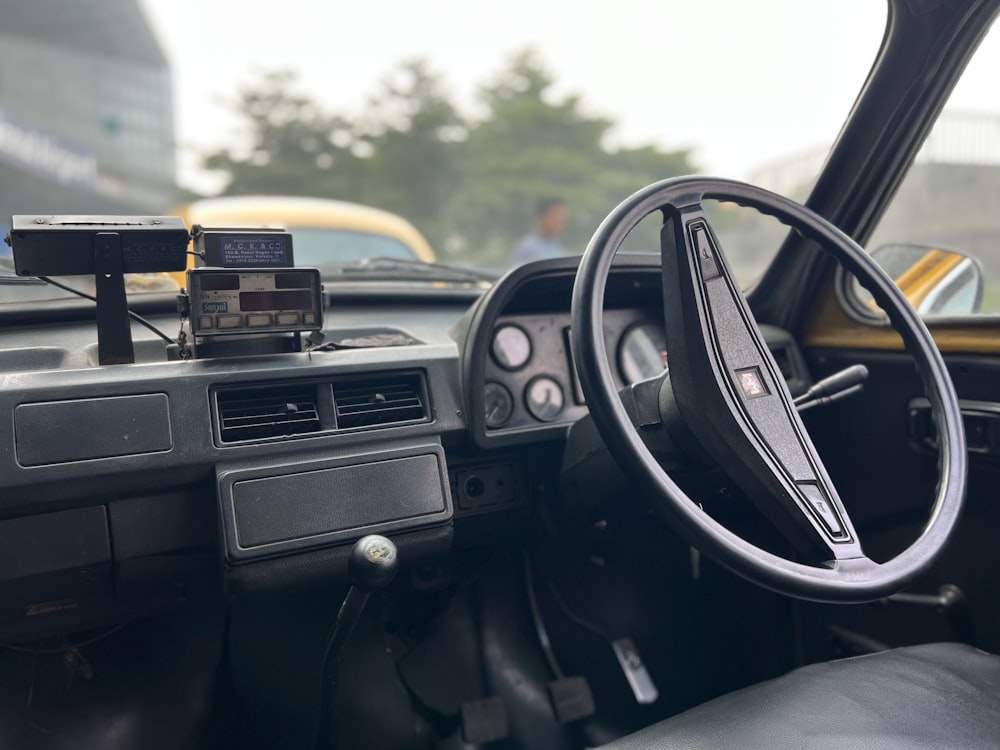 a car dashboard with a dash board and steering wheel