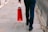 A satisfied customer holding a shopping bag.