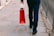 A satisfied customer holding a shopping bag.