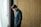 a man standing in front of a window