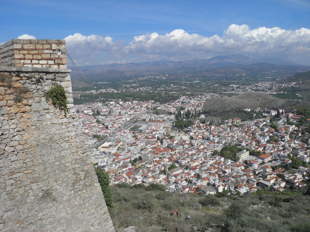 a view of a city from the top of a hill