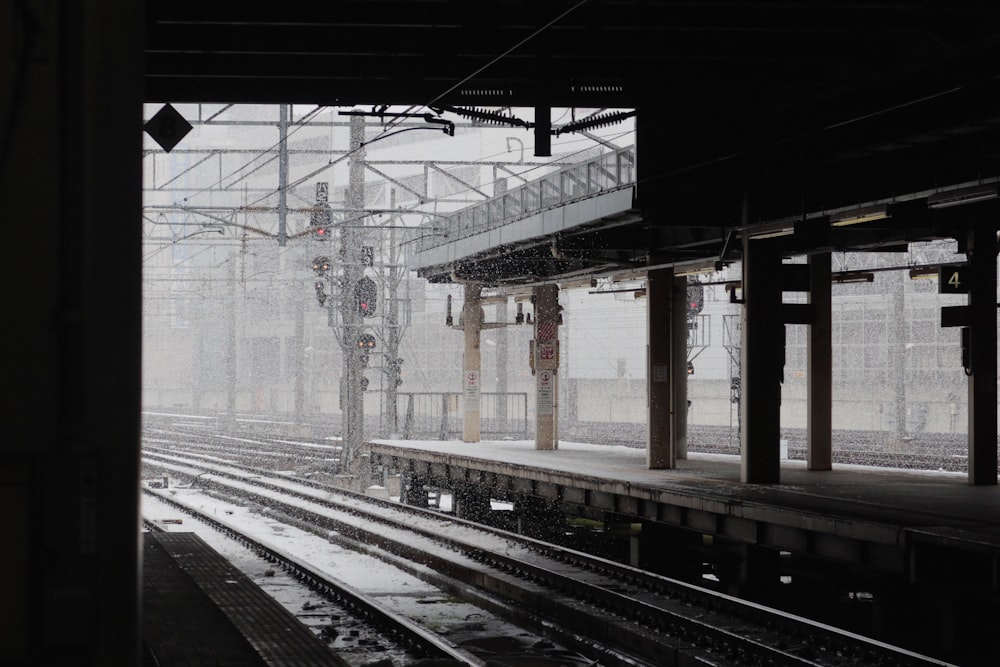 a black and white photo of a train station