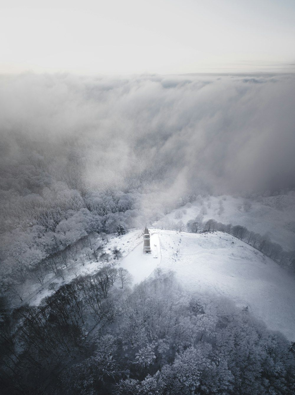 an aerial view of a mountain covered in snow