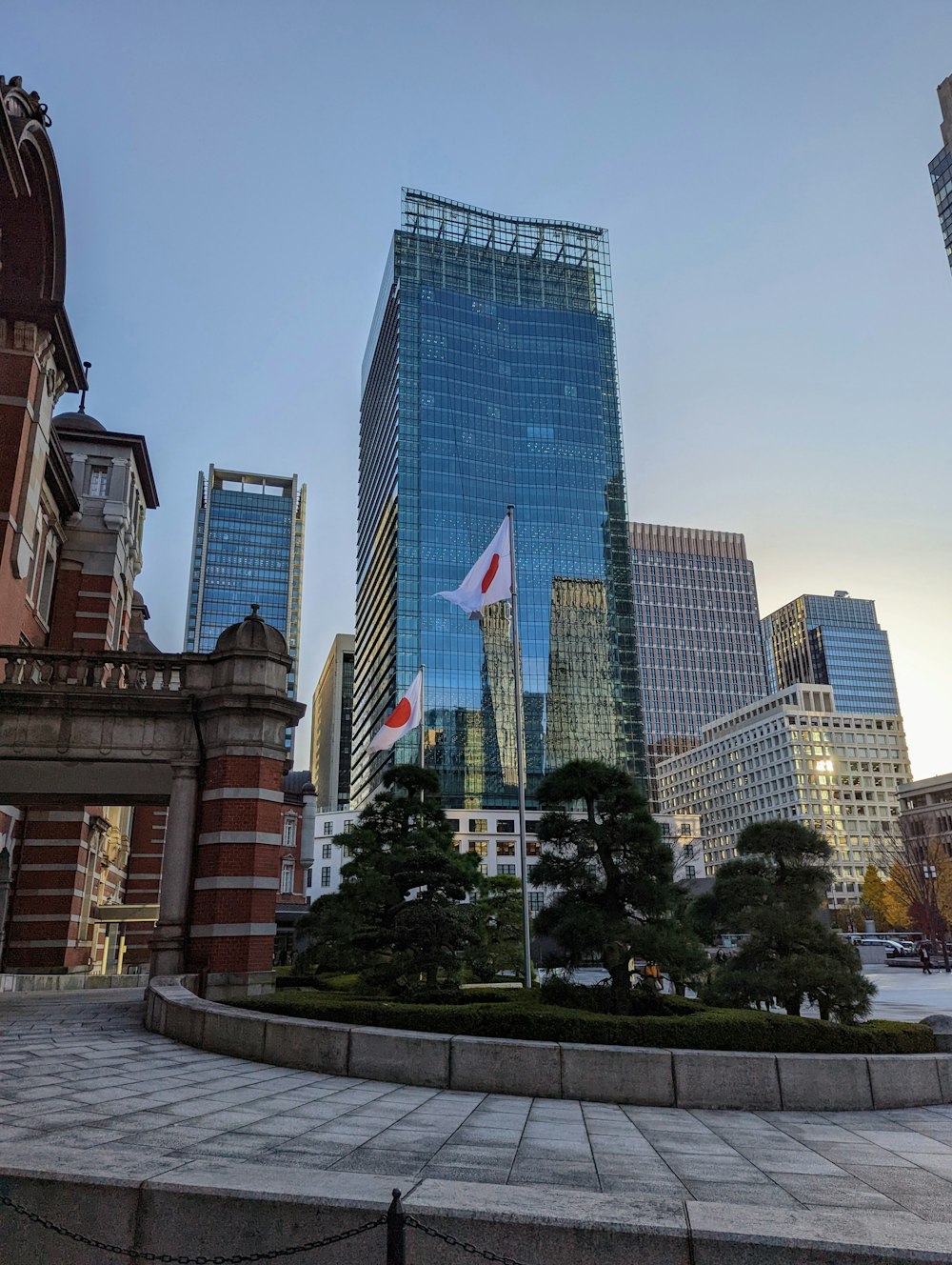 a statue of a canadian flag in a city square