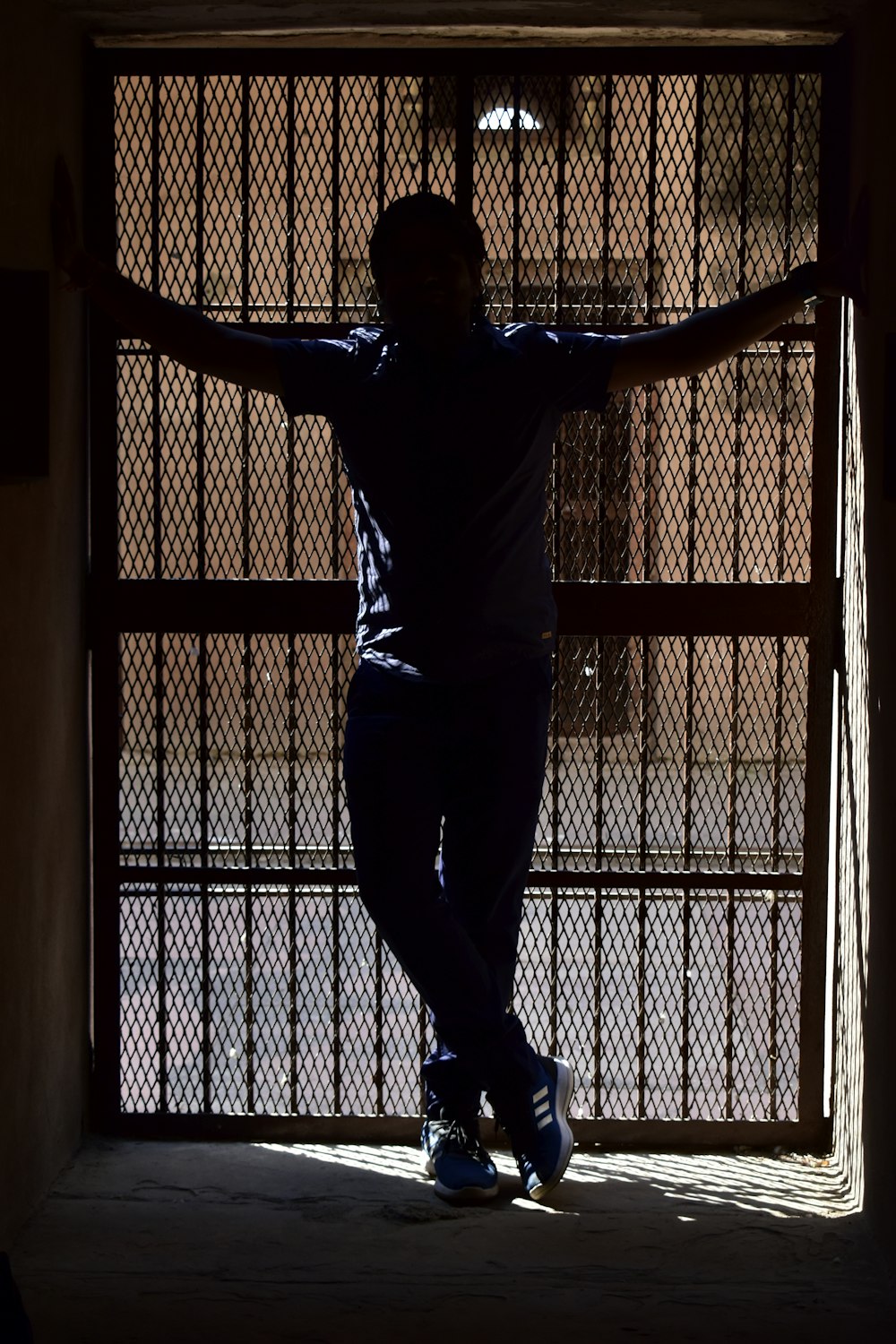 a person standing in front of a gate