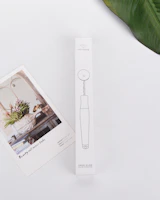 An elegant product card featuring a stylish accessory on a soft pastel backdrop