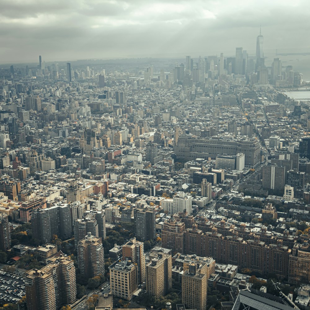 an aerial view of a city with tall buildings