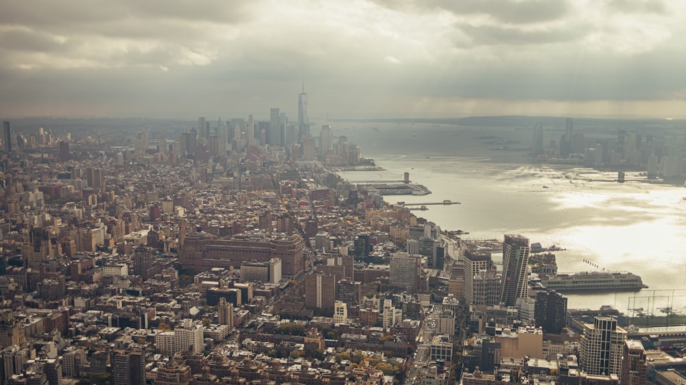 an aerial view of a city and a body of water