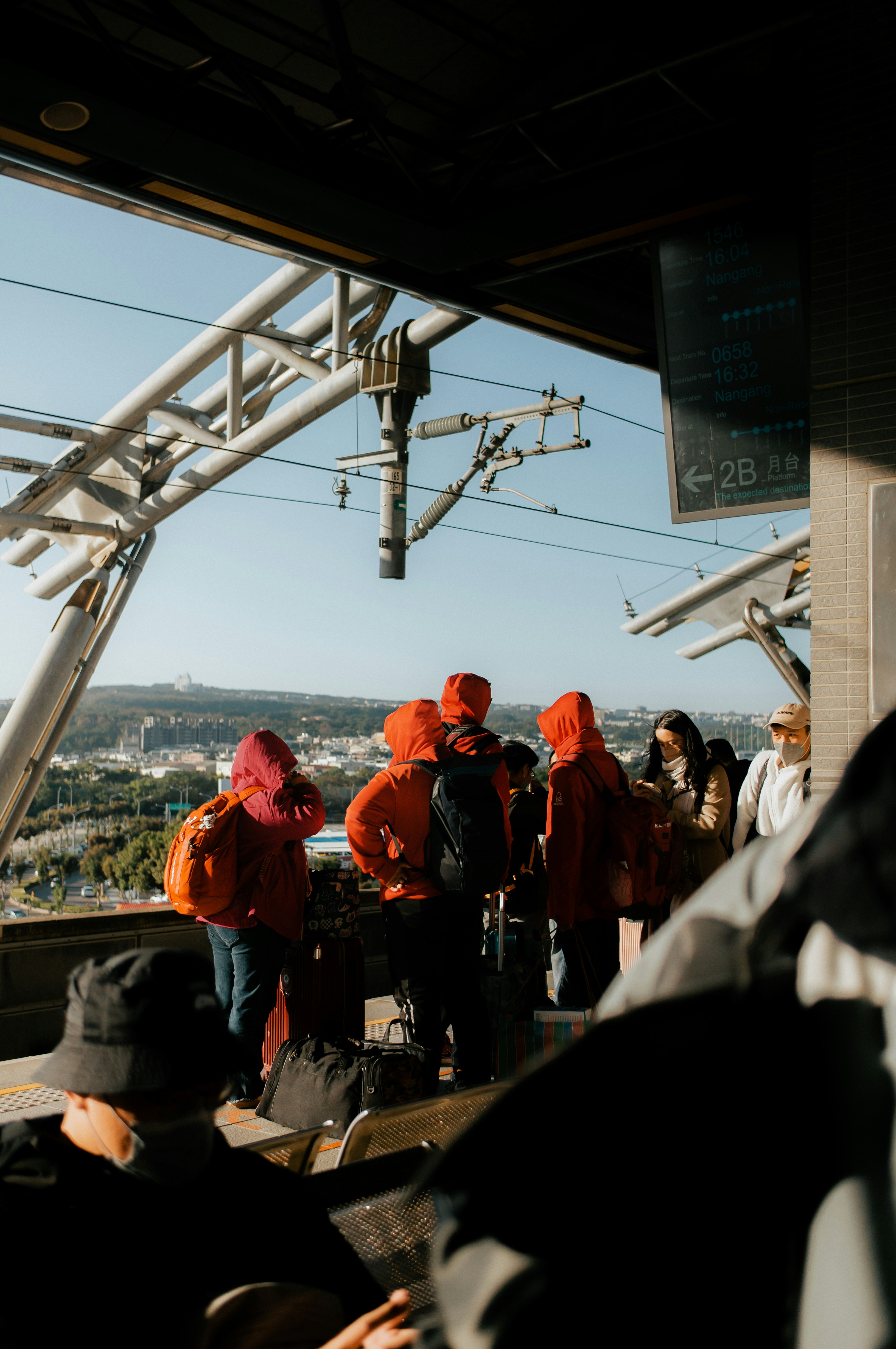 a group of people standing on top of a building