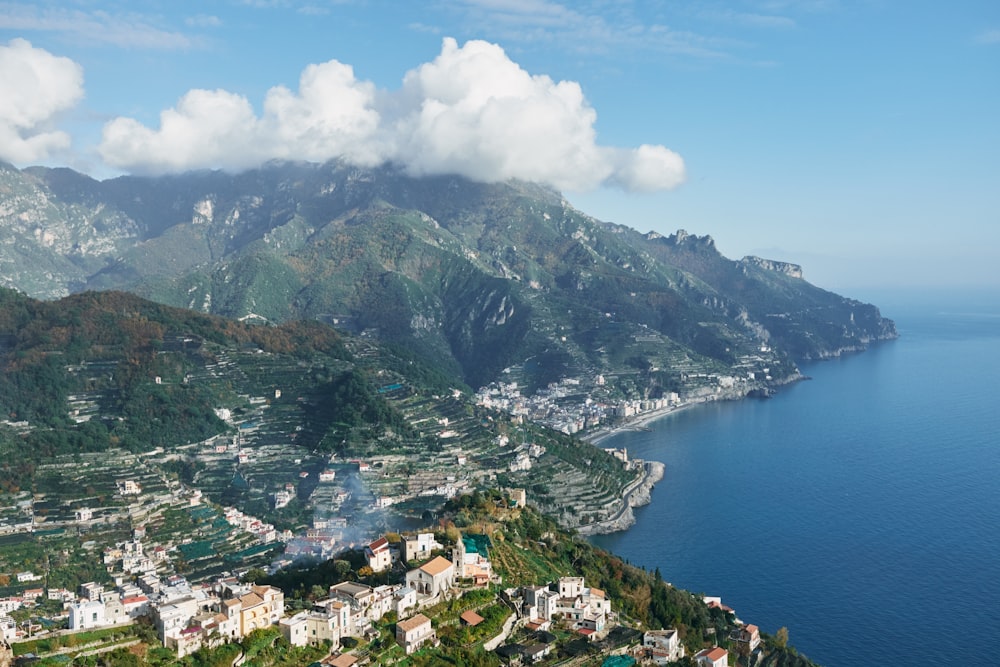 an aerial view of a town and a body of water