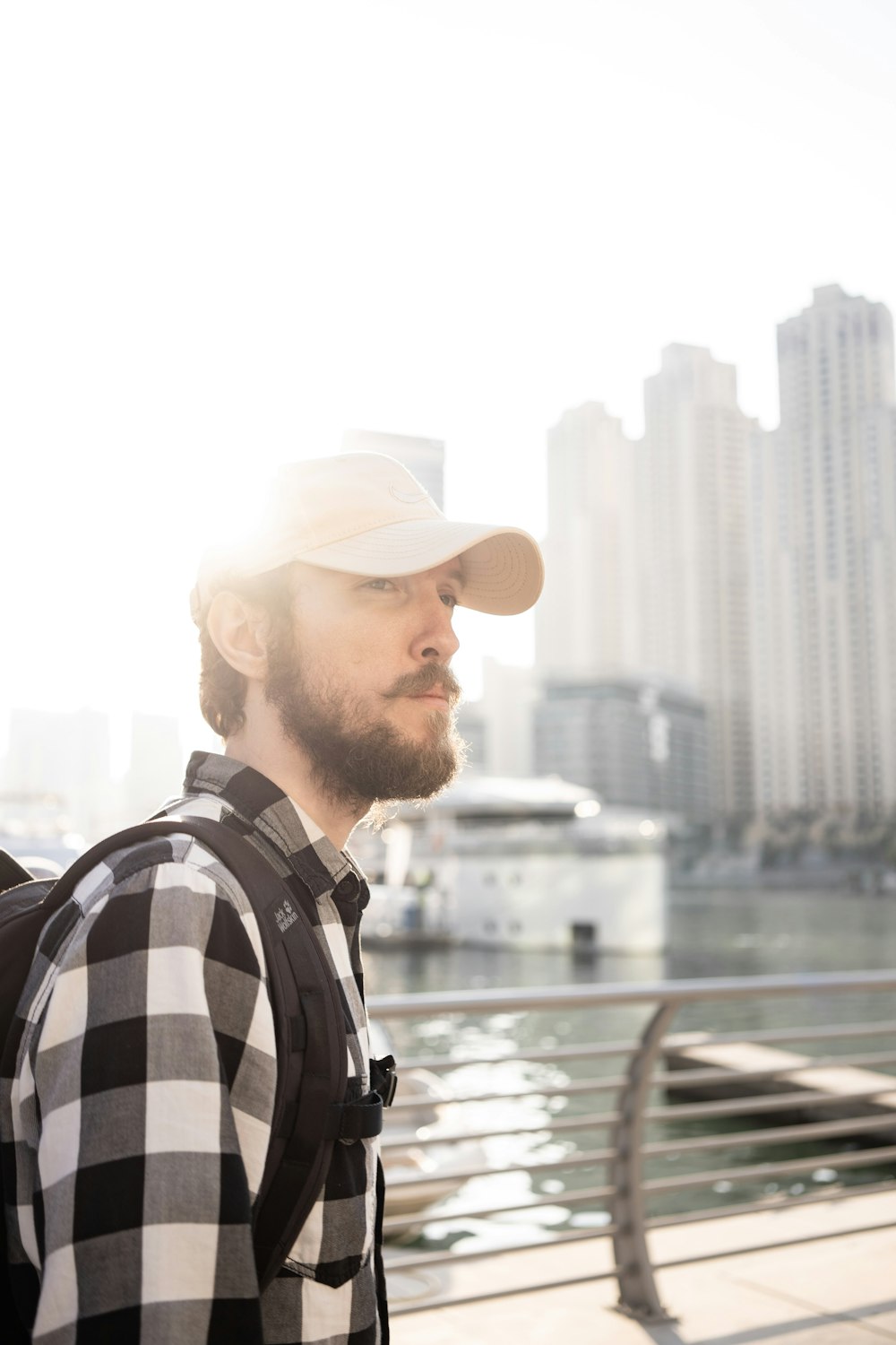 a man with a beard wearing a hat