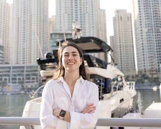 Md Nur Alam smiling confidently in front of a luxury townhouse in New York City.