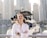 A satisfied customer standing next to their yacht after inspection.