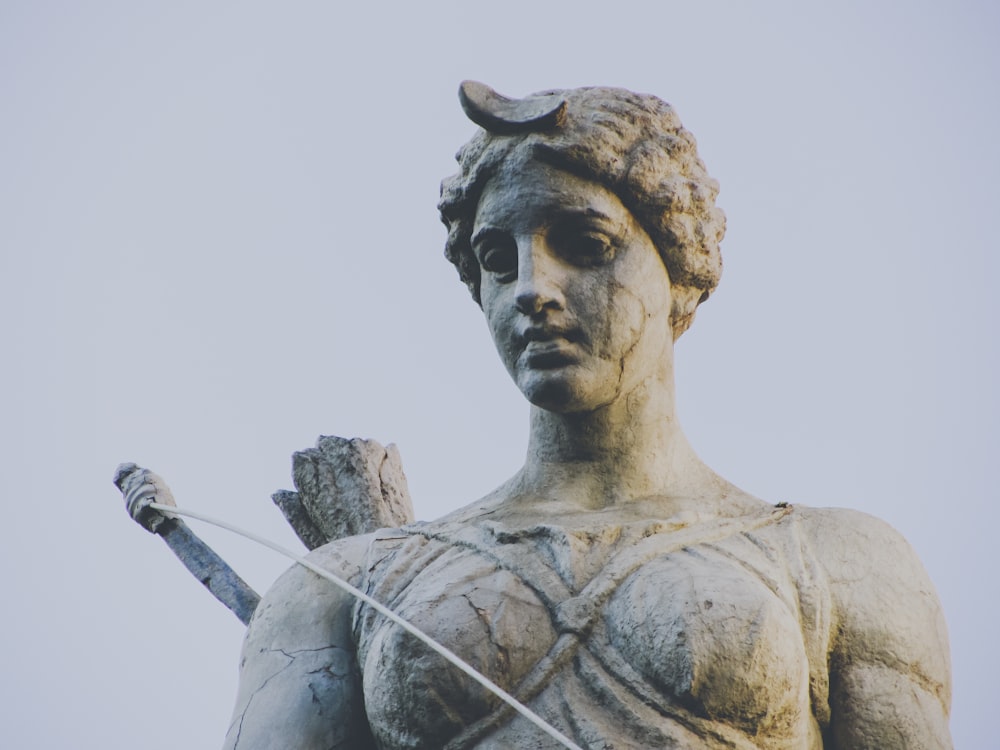 a statue of a woman holding a sword