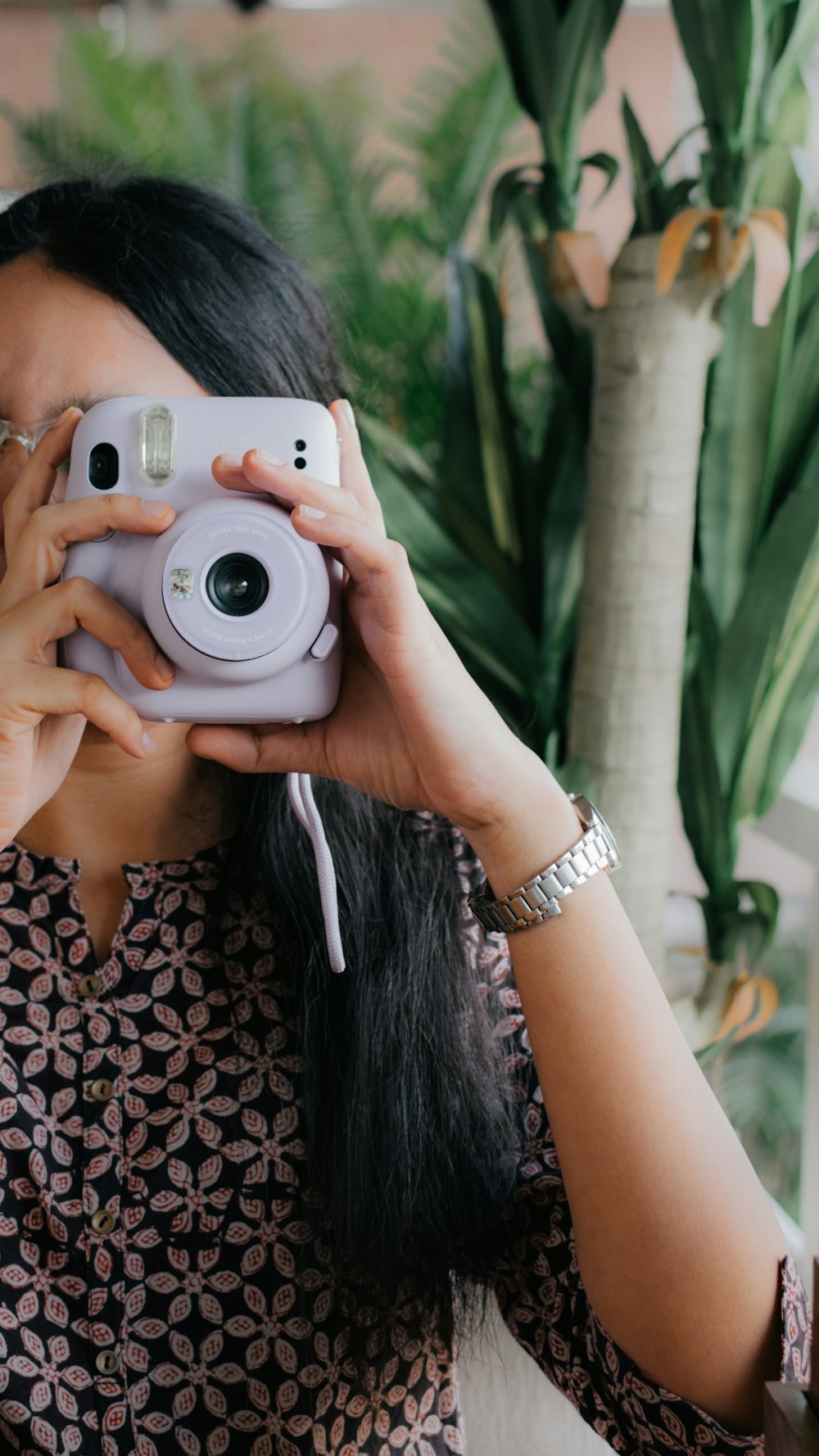 a woman taking a picture with a camera