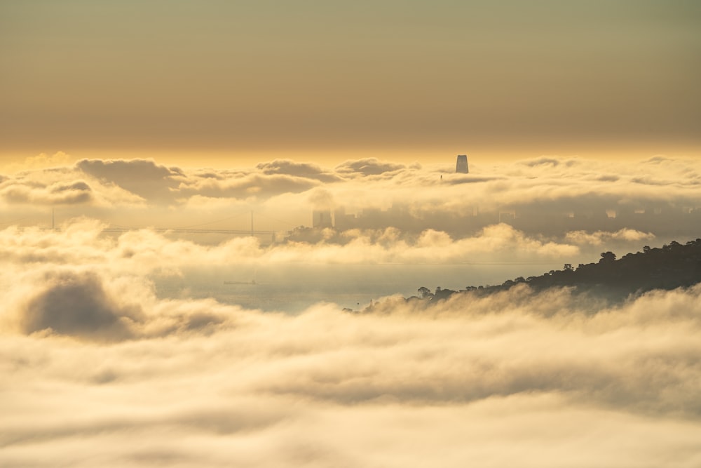 a view of a city from above the clouds